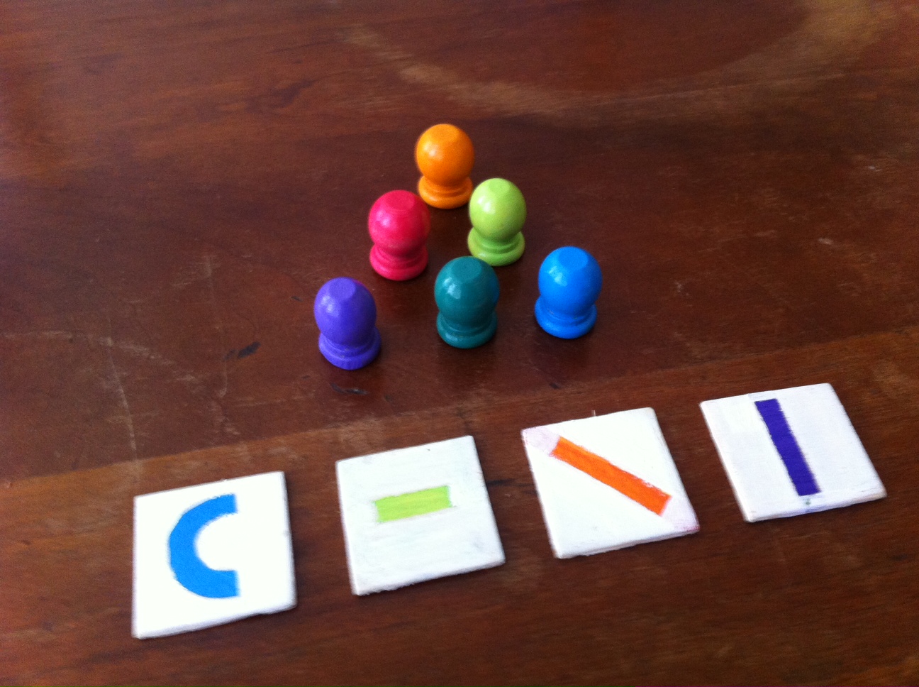 Hand painted wooden game pieces by Glyfyx